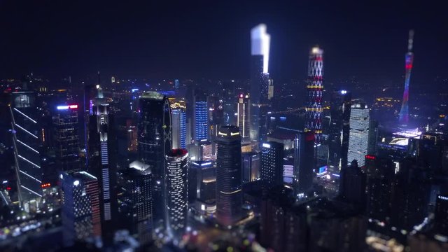 night time illumination guangzhou cityscape downtown aerial panorama tilt-shift 4k china