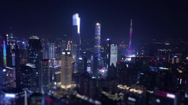 night time illumination guangzhou cityscape downtown aerial panorama tilt-shift 4k china