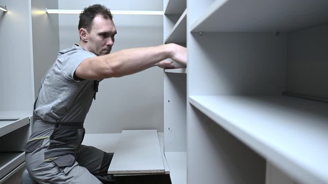 Apartment Cabinets and Storage Finishing by Professional Caucasian Cabinets Installer. Closet Rack Assembly. Interior Furnishing.
