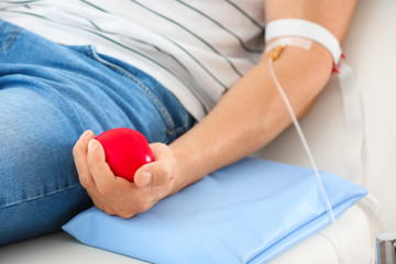 Man donating blood in hospital