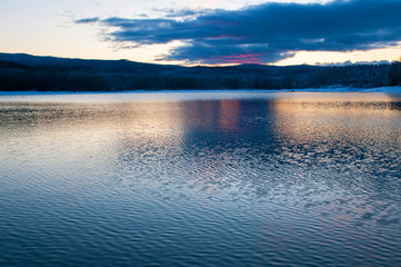 Fototapeta na wymiar colorful sunrise over winter lake