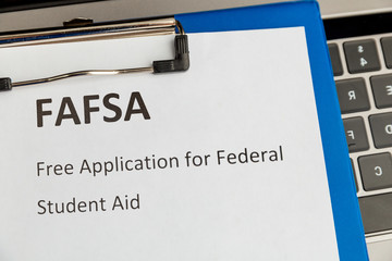 Fafsa. Student aid application form on the tablet