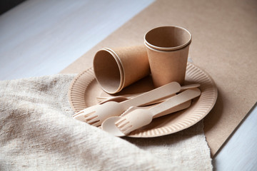 eco paper plate dish fork on old wooden table