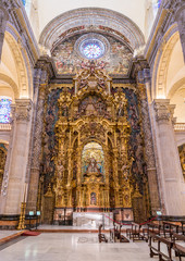 Fototapeta na wymiar Finely decorated altar in the Divino Salvador Church in Seville. Andalusia, Spain.