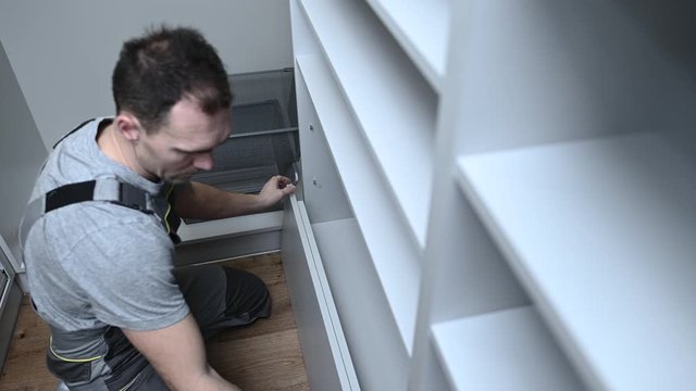 Closet Cabinets Contractor. Finishing Wooden Wardrobe by Professional Installer.
