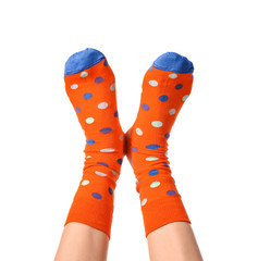Legs of young woman in socks on white background