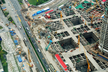 Bird view at skyscraper's foundations, construction site in China.