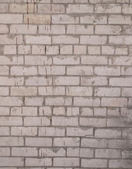 top view of a brick wall stained with drops of brown paint