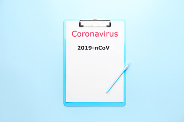 Paper sheet with text "Coronavirus" on color background