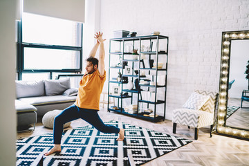 Motivated male athlete training alone at home