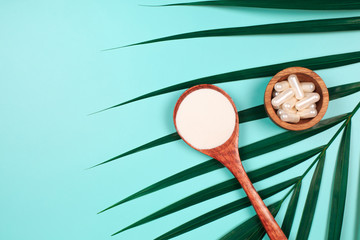 Different types of collagen on palm leaf. Powder, capsules, tablets and fluid.