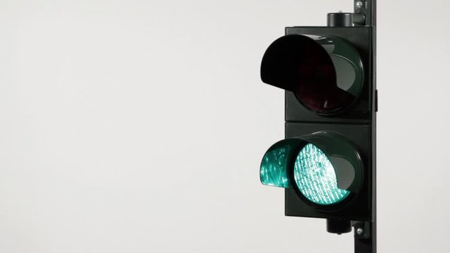 CU, Lockdown, studio shot of a red and green stoplight blinking on and off