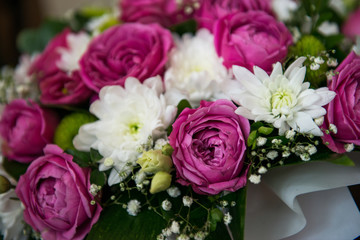 Pink and white roses and daisies. beautiful bouquet of flowers as a natural background.