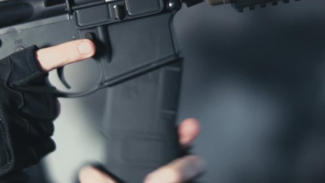 Security Contractor doing a tactical reload of AR15 rifle