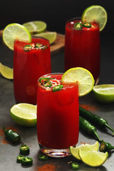 Jalapeno tomato margarita cocktail with lime