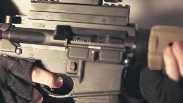 Security Contractor doing a tactical reload of AR15 rifle