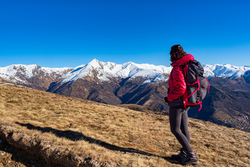 Woman backpacker in the italian alps