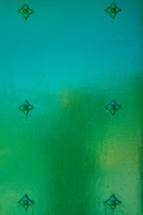 Green background with metal rivets