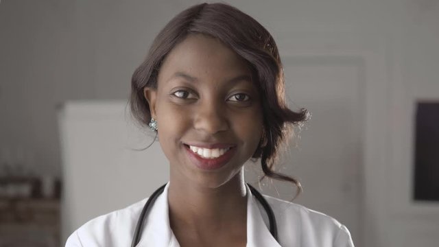 Portrait of a young smiling black african american doctor.