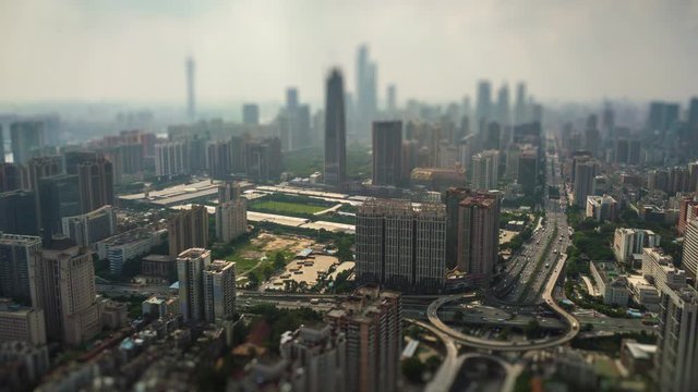 sunny day guangzhou downtown cityscape traffic road junction aerial tilt shift panorama 4k timelapse china