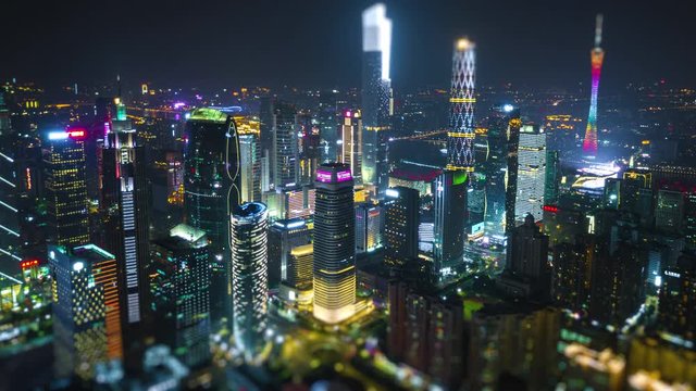 night time illuminated guangzhou city downtown famous buildings aerial tilt shift panorama 4k timelapse china