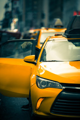 New York City Street scene with iconic yellow taxi cab