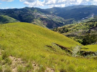 Mountain landscape with green meadows and blue sky in Venezuela