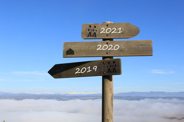 three signs indicating the way to 2019, 2021 or 2020 year