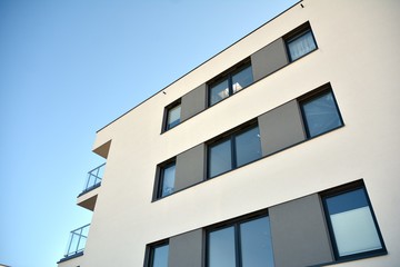 Contemporary residential building exterior in the daylight. Modern and new apartment building. 