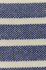 Fototapeta na wymiar Close up texture of natural weave cloth in blue color. Fabric texture of natural cotton or linen textile material.background.