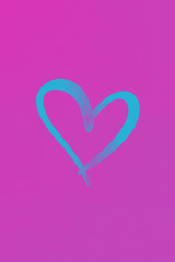 Obraz na płótnie Canvas View of a blue heart on a pink background. Holiday concept, Valentine's Day, art, background, love