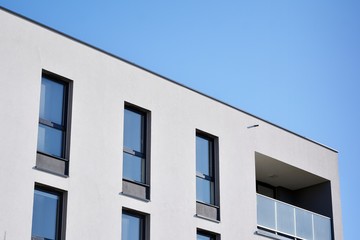 Contemporary residential building exterior in the daylight. Modern and new apartment building. 
