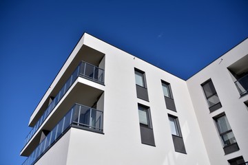 Contemporary residential building exterior in the daylight. Modern and new apartment building. 