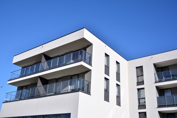 Contemporary residential building exterior in the daylight. Modern and new apartment building. 