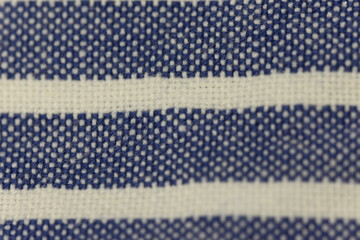 Fototapeta na wymiar Close up texture of natural weave cloth in blue and white stripes. Fabric texture of natural cotton or linen textile material.background.