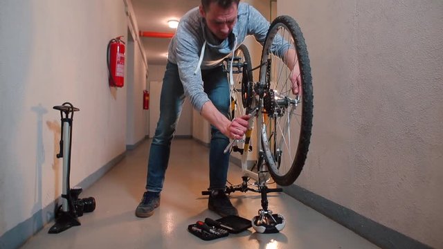 A man does an express bike inspection before servicing.