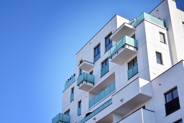 Contemporary residential building exterior in the daylight. Modern and new apartment building. 