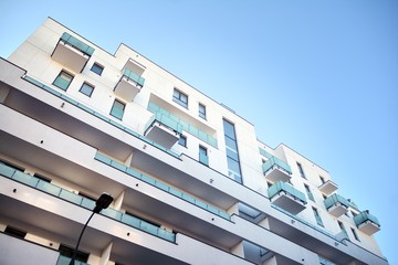 Contemporary residential building exterior in the daylight. Modern and new apartment building. 