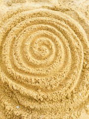 Fototapeta na wymiar Spiral pattern in the sand