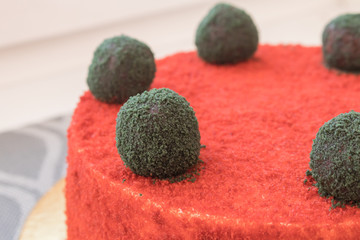 Red velvet cake decorated with edible green balls