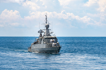 Guided missile corvette type navy ship sails in the sea to protect sea line of communcation or SLOC.