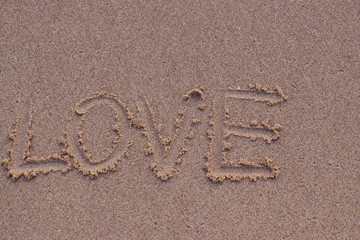  On the sand, there was a letter saying love