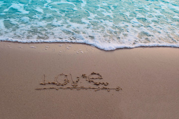  On the sand, there was a letter saying love