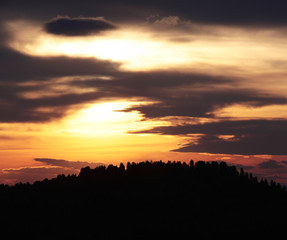 Dramatic sunset sky, evening sky over the forest