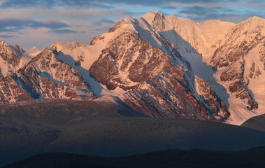 Mountain view, hiking in the mountains. Dawn light on the tops. Traveling in Russia, Altay.
