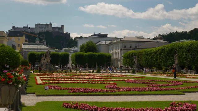 sunny day salzburg city famous tourist crowded garden castle view slow motion panorama 4k austria