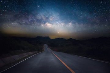 Road and milky way with mountain at night. - Powered by Adobe
