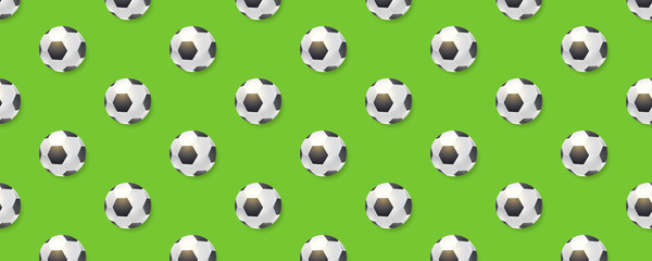 Seamless pattern from football balls. Balls for soccer isolated on long green background. Seamless decoration for sports promotion. Template for t-shirts, fabric, banners. Vector 3d illustration.