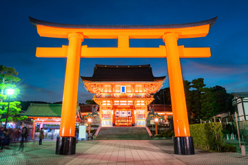Night scenery of Vermilion torii gate and Hall at entrance of Fushimi Inari Shrine which is The...