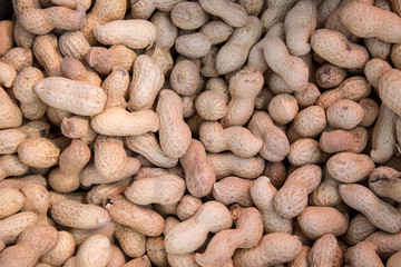 Peanuts are scattered on the table. Background for design